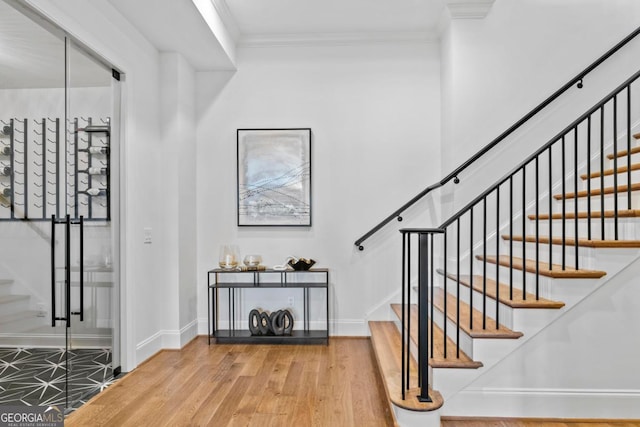 1230 Lake Club Dr, Greensboro, GA 30642 - stairs with wood finished floors and ornamental molding