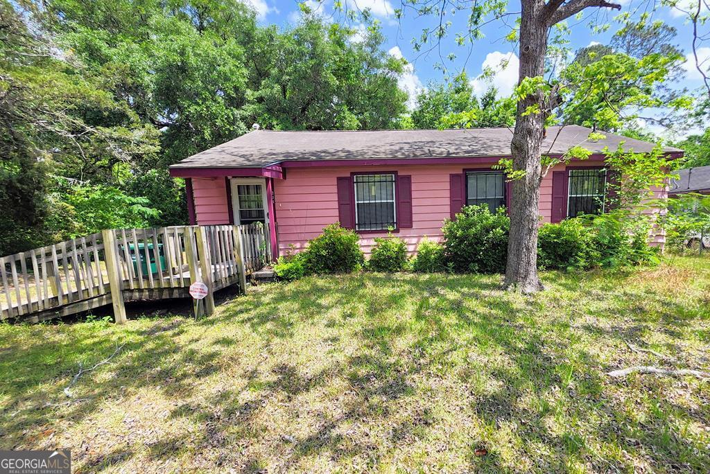 234 Cone St, Albany, GA 31705 - view of front facade with a front lawn and a wooden deck