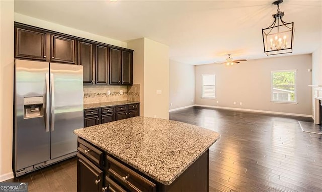219 Sleepy Way, Canton, GA 30114 - kitchen with stainless steel fridge with ice dispenser, healthy amount of natural light, backsplash, and light stone countertops