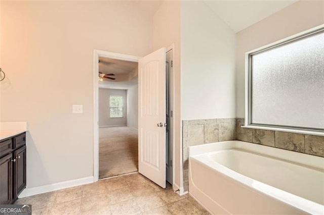 219 Sleepy Way, Canton, GA 30114 - full bathroom with a garden tub, vanity, a ceiling fan, and vaulted ceiling