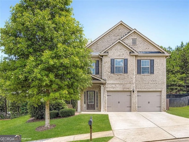 219 Sleepy Way, Canton, GA 30114 - view of front of property featuring an attached garage, concrete driveway, a front yard, and brick siding