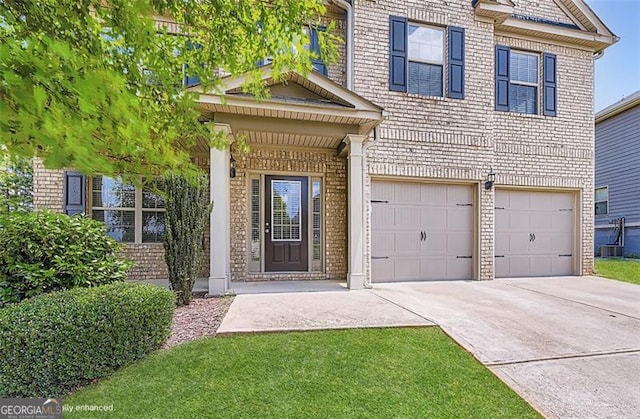 219 Sleepy Way, Canton, GA 30114 - view of front of house with driveway, a garage, and brick siding