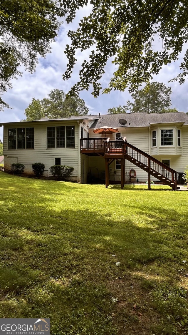 5904 Clairmont Way, Powder Springs, GA 30127 - rear view of house with stairway, a wooden deck, and a lawn