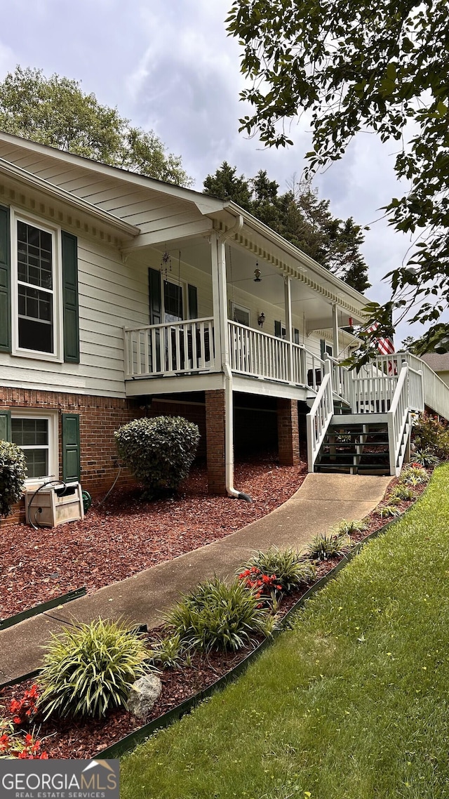 5904 Clairmont Way, Powder Springs, GA 30127 - view of home's exterior with covered porch and stairs