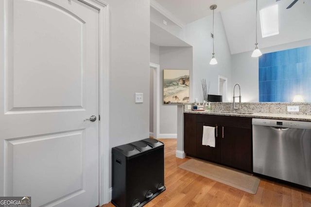 1903 Anjaco Rd NW Unit 5, Atlanta, GA 30309 - kitchen with stainless steel dishwasher, light wood-style floors, lofted ceiling, light stone counters, and a skylight