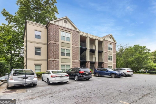 1903 Anjaco Rd NW Unit 5, Atlanta, GA 30309 - view of building exterior featuring uncovered parking