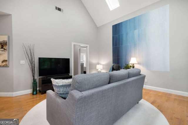 1903 Anjaco Rd NW Unit 5, Atlanta, GA 30309 - living room with light wood-style flooring, a skylight, and high vaulted ceiling