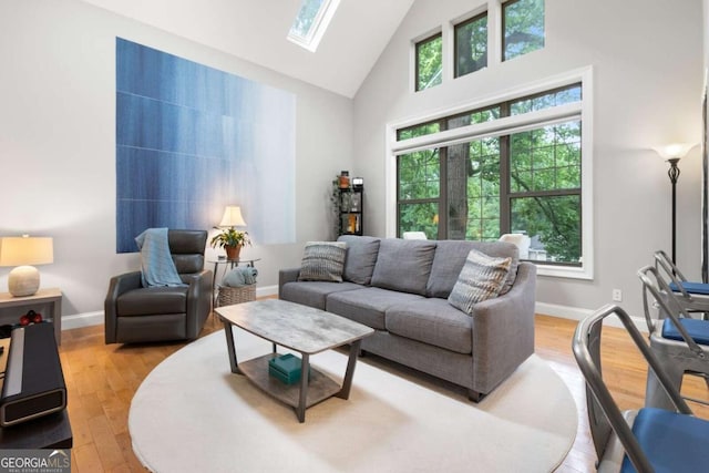 1903 Anjaco Rd NW Unit 5, Atlanta, GA 30309 - living room with a skylight, high vaulted ceiling, and wood finished floors