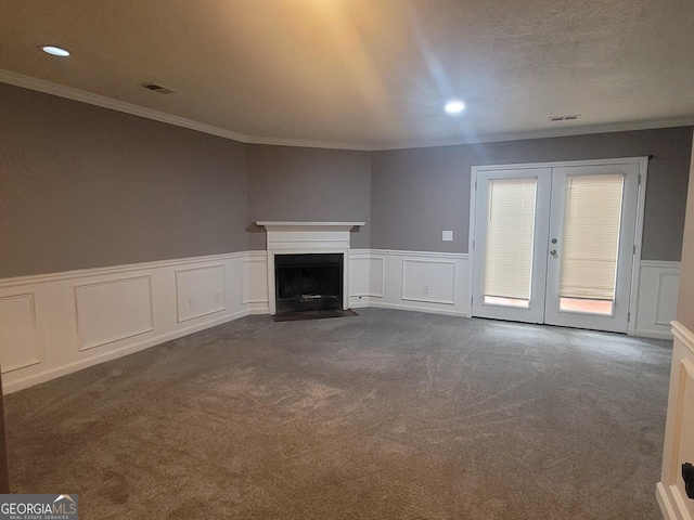 2052 Charter Ln, Lithonia, GA 30058 - unfurnished living room featuring ornamental molding, dark carpet, french doors, wainscoting, and recessed lighting