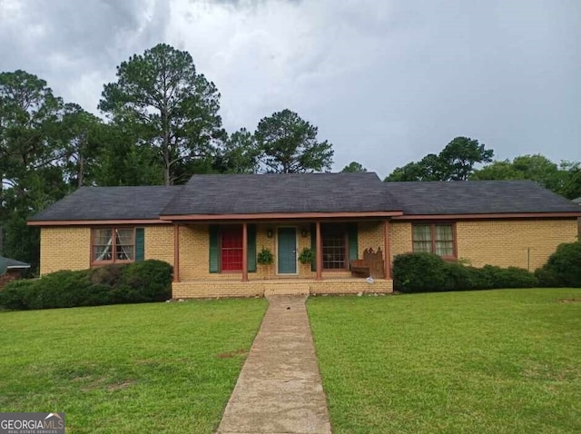 1806 Dawson Rd, Albany, GA 31707 - ranch-style house featuring brick siding, a front lawn, and a porch