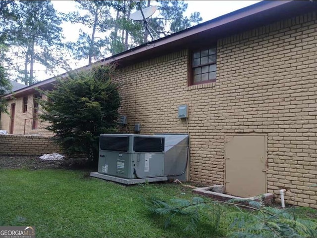 1806 Dawson Rd, Albany, GA 31707 - view of home's exterior with brick siding and a yard