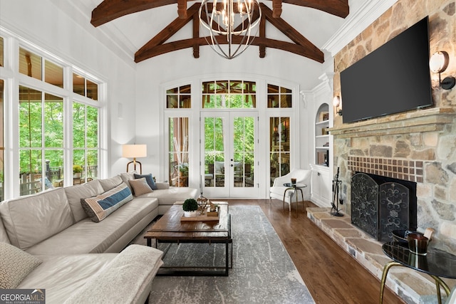 4874 Kettle River Pt, Suwanee, GA 30024 - living area with beam ceiling, wood finished floors, high vaulted ceiling, a fireplace, and french doors