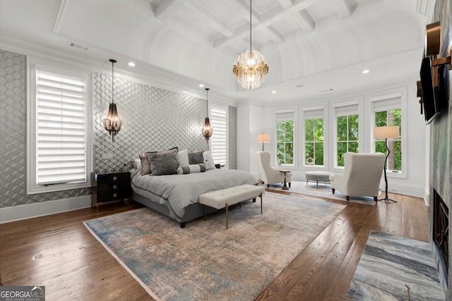 4874 Kettle River Pt, Suwanee, GA 30024 - bedroom with wallpapered walls, a chandelier, an accent wall, dark wood-style flooring, and coffered ceiling