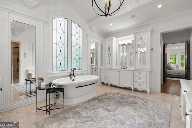 4874 Kettle River Pt, Suwanee, GA 30024 - ensuite bathroom with a chandelier, vanity, a freestanding tub, and ornamental molding