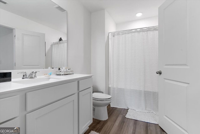 161 Swindon Dr, Mcdonough, GA 30253 - full bathroom featuring vanity, wood finished floors, and shower / bath combination with curtain