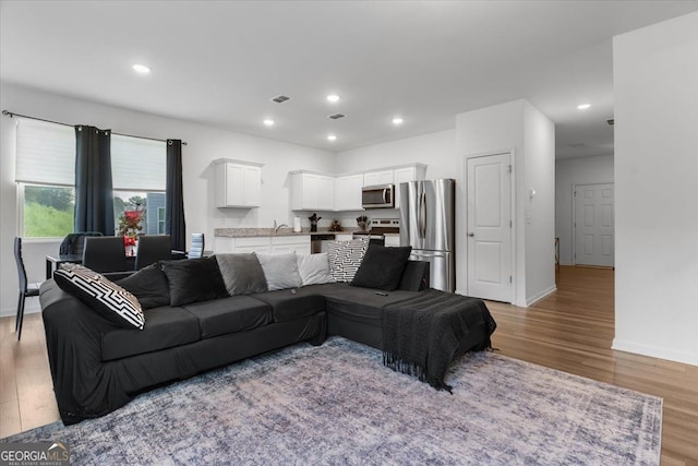 161 Swindon Dr, Mcdonough, GA 30253 - living room with light wood-type flooring and recessed lighting