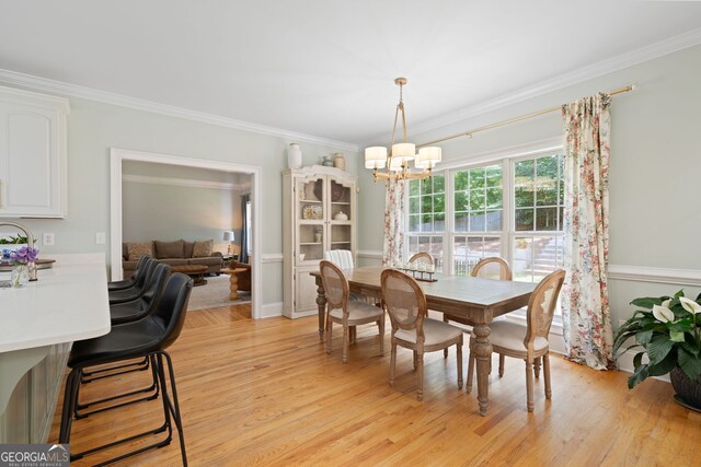 3095 Chattahoochee Trce, Gainesville, GA 30506 - dining room with a chandelier, light wood finished floors, and ornamental molding