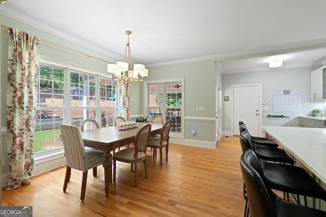 3095 Chattahoochee Trce, Gainesville, GA 30506 - dining space with a chandelier, ornamental molding, and light wood-type flooring