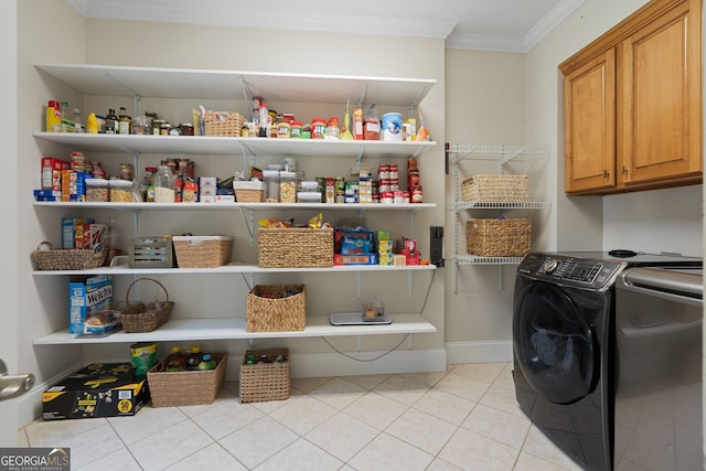 3095 Chattahoochee Trce, Gainesville, GA 30506 - laundry room featuring crown molding, light tile patterned flooring, and washing machine and dryer