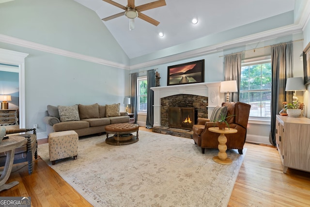 3095 Chattahoochee Trce, Gainesville, GA 30506 - living area featuring plenty of natural light, ceiling fan, wood finished floors, high vaulted ceiling, and a fireplace