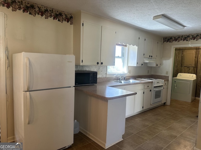 421 Chase Cir, Cornelia, GA 30531 - kitchen with white appliances, washer / dryer, white cabinetry, under cabinet range hood, and a peninsula