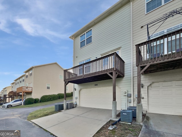 2438 Suwanee Pointe Dr, Lawrenceville, GA 30043 - rear view of property featuring a garage, driveway, a residential view, and a balcony