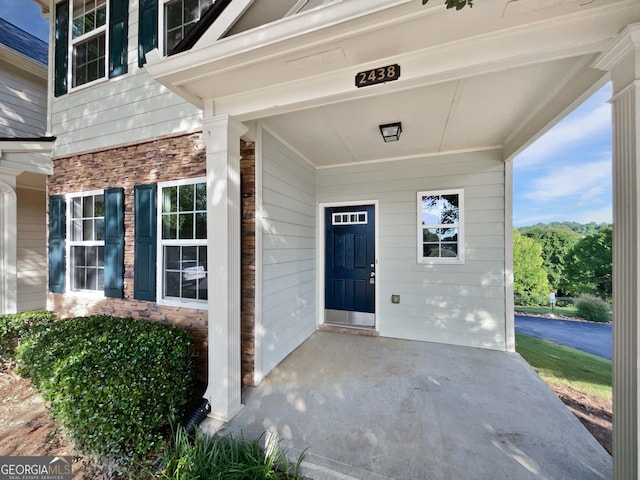 2438 Suwanee Pointe Dr, Lawrenceville, GA 30043 - doorway to property featuring stone siding