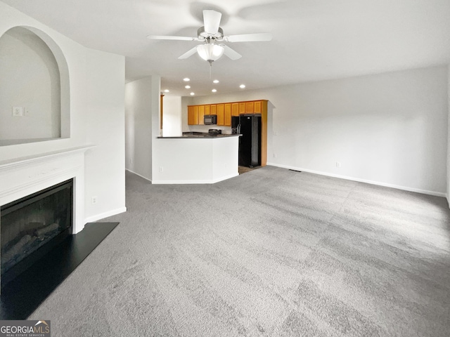 2438 Suwanee Pointe Dr, Lawrenceville, GA 30043 - unfurnished living room featuring recessed lighting, a ceiling fan, carpet floors, and a fireplace with raised hearth