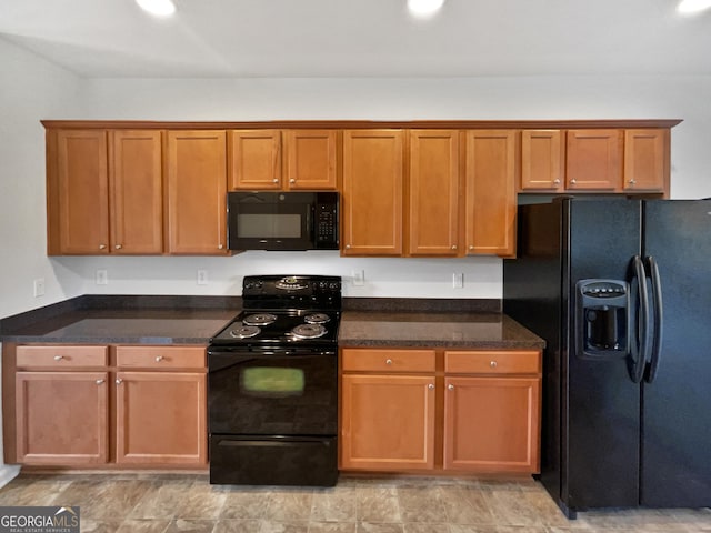 2438 Suwanee Pointe Dr, Lawrenceville, GA 30043 - kitchen with black appliances, brown cabinetry, and dark stone counters