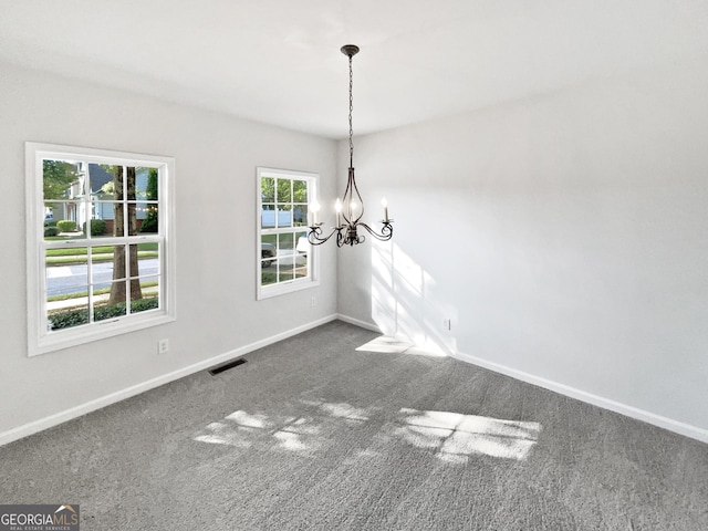2438 Suwanee Pointe Dr, Lawrenceville, GA 30043 - unfurnished dining area with a chandelier and dark carpet