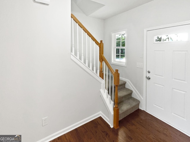 2438 Suwanee Pointe Dr, Lawrenceville, GA 30043 - foyer entrance with dark wood-style flooring and stairway
