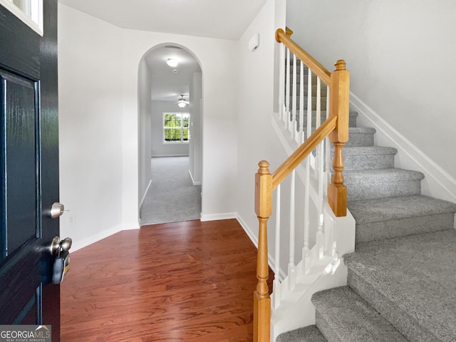 2438 Suwanee Pointe Dr, Lawrenceville, GA 30043 - foyer with arched walkways, stairway, wood finished floors, and ceiling fan
