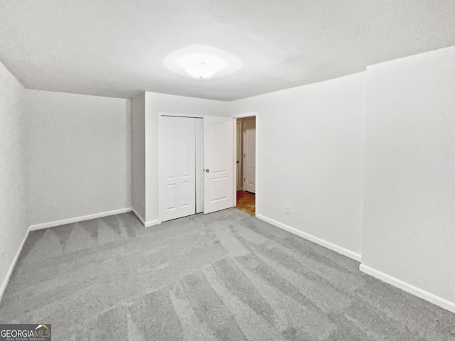 2438 Suwanee Pointe Dr, Lawrenceville, GA 30043 - unfurnished bedroom with carpet flooring and a closet