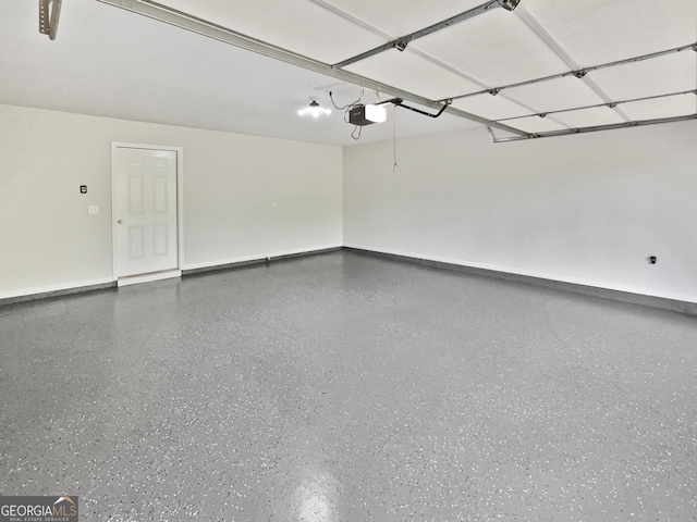 2438 Suwanee Pointe Dr, Lawrenceville, GA 30043 - garage featuring a garage door opener and baseboards