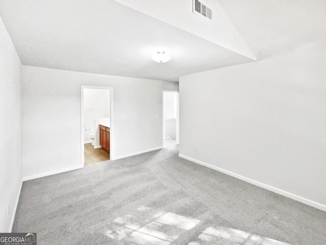 2438 Suwanee Pointe Dr, Lawrenceville, GA 30043 - spare room featuring carpet and lofted ceiling