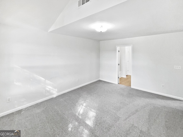 2438 Suwanee Pointe Dr, Lawrenceville, GA 30043 - unfurnished room featuring carpet floors and vaulted ceiling