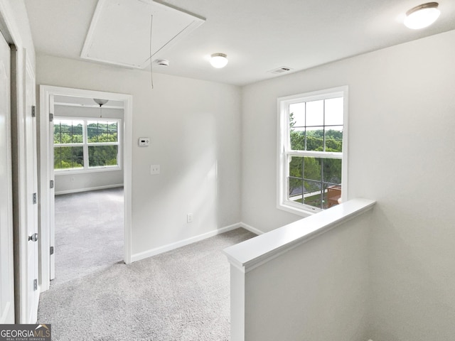 2438 Suwanee Pointe Dr, Lawrenceville, GA 30043 - carpeted empty room with attic access and plenty of natural light