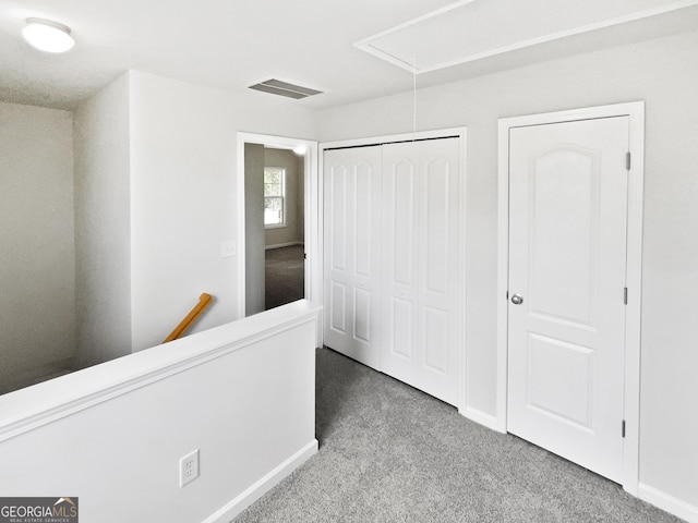 2438 Suwanee Pointe Dr, Lawrenceville, GA 30043 - corridor with attic access, an upstairs landing, and carpet