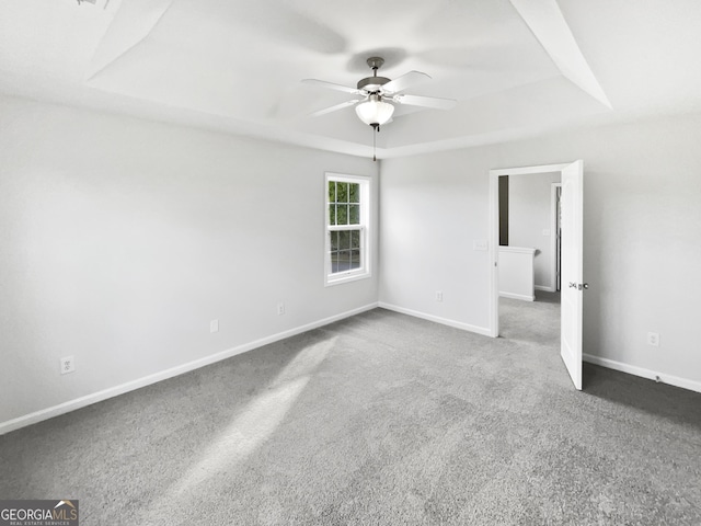 2438 Suwanee Pointe Dr, Lawrenceville, GA 30043 - carpeted spare room featuring a raised ceiling and ceiling fan