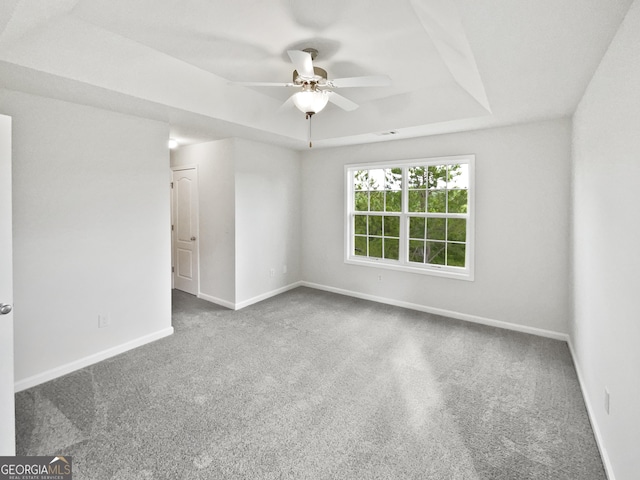 2438 Suwanee Pointe Dr, Lawrenceville, GA 30043 - unfurnished room featuring a ceiling fan, carpet flooring, and a raised ceiling