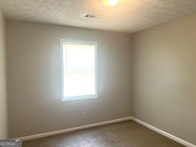 4263 Southvale Dr, Decatur, GA 30034 - carpeted empty room with plenty of natural light and a textured ceiling