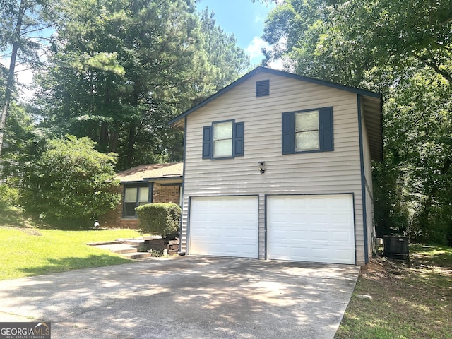 4263 Southvale Dr, Decatur, GA 30034 - tri-level home with an attached garage, driveway, a front lawn, and brick siding