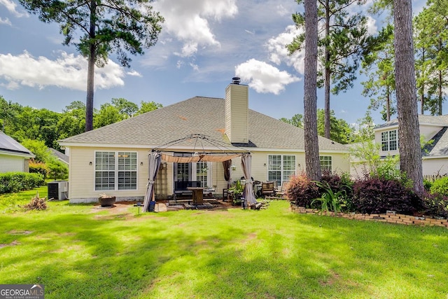 148 Fire Thorn, Pooler, GA 31322 - back of property featuring a gazebo, a lawn, a chimney, a patio area, and a shingled roof