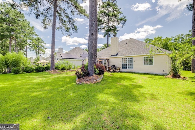 148 Fire Thorn, Pooler, GA 31322 - rear view of property with a lawn and a chimney
