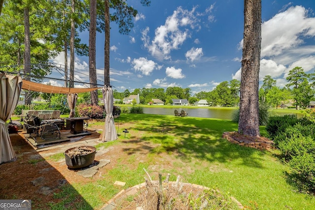 148 Fire Thorn, Pooler, GA 31322 - view of green lawn featuring a water view, a fire pit, and a gazebo