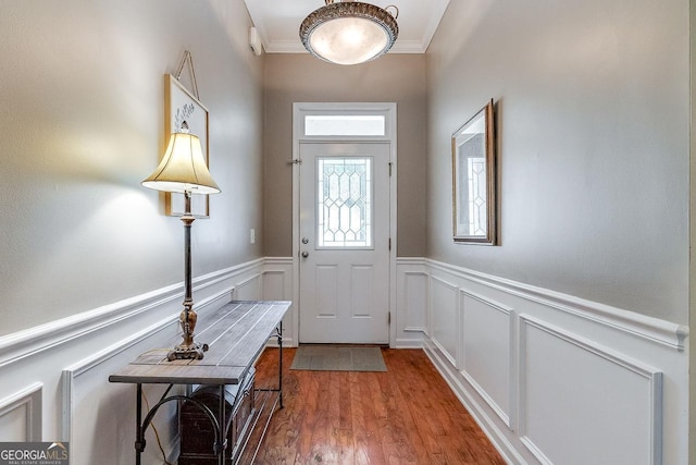 148 Fire Thorn, Pooler, GA 31322 - entrance foyer featuring wood finished floors, a wainscoted wall, crown molding, and a decorative wall