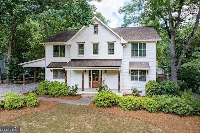 175 Pinecrest Ct, Athens, GA 30605 - view of front of home with a porch, a standing seam roof, driveway, and a metal roof