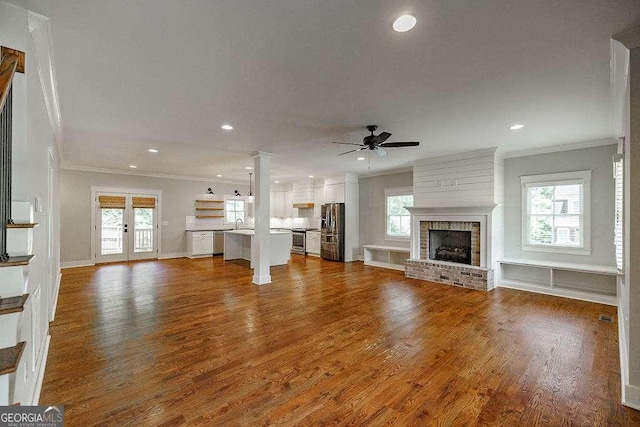175 Pinecrest Ct, Athens, GA 30605 - unfurnished living room with ornamental molding, a ceiling fan, recessed lighting, plenty of natural light, and a fireplace