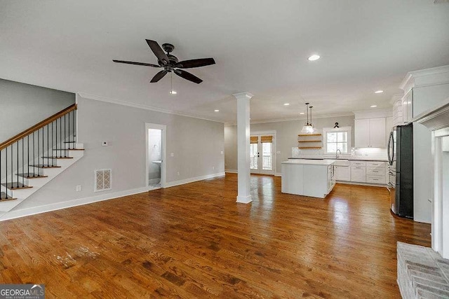 175 Pinecrest Ct, Athens, GA 30605 - unfurnished living room featuring decorative columns, ornamental molding, ceiling fan, recessed lighting, and wood finished floors