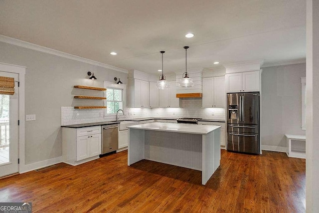 175 Pinecrest Ct, Athens, GA 30605 - kitchen with stainless steel appliances, crown molding, open shelves, white cabinets, and a center island